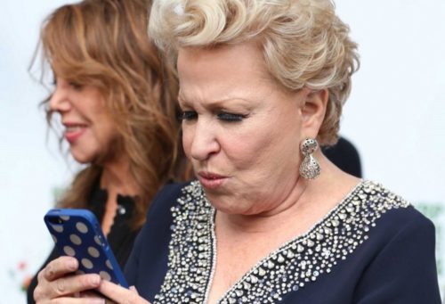 Bette-Midler-checking-phone-angry-face-728×497