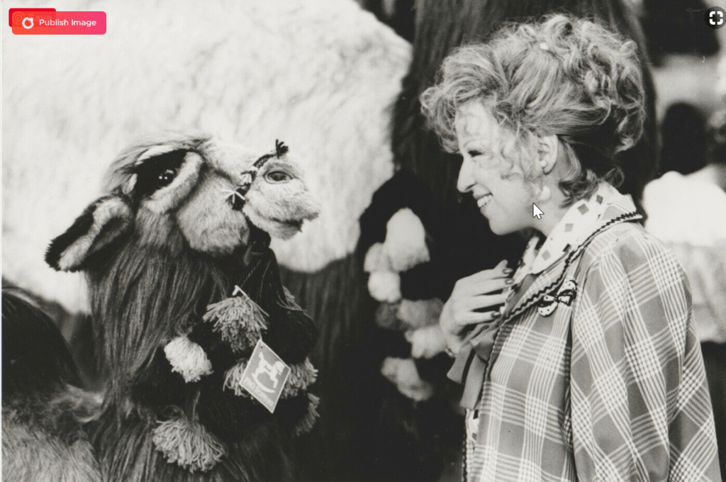 Bette Midler on the set of Big Business with a special friend