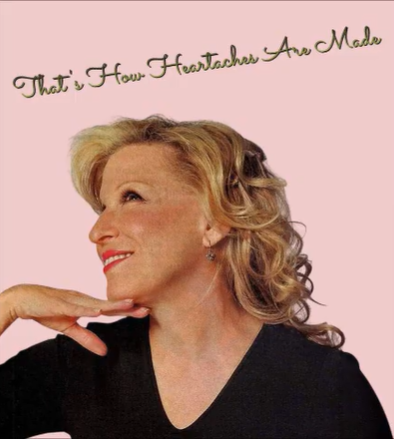 Portrait of a smiling blonde woman in a black top, posed with her hand under her chin against a pink background. The top caption reads: "That's How Heartthroachers Are Made."