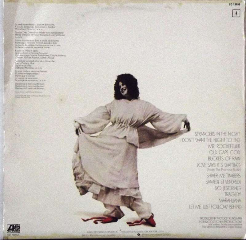Dancer in a flowing white robe with red shoes, mid-mance on a pale backdrop; tracklist text appears on the right side of the cover.