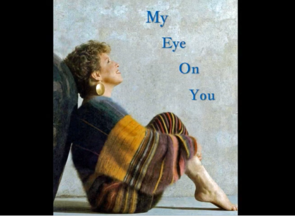 2026-06-10_14-33-45 - bootleg betty Book cover: a woman wrapped in a striped blanket sits on the floor, head tilted back, title 'My Eye On You' along the right.