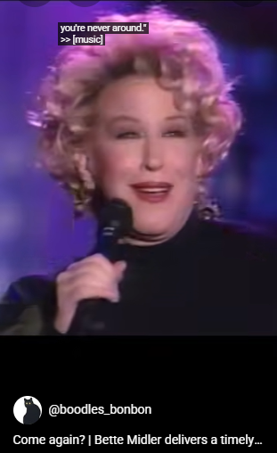 Female singer with curly blonde hair holding a microphone on stage; on-screen caption reads 'you're never around! >> [music]'. Social handle @boodles_bonbon visible.