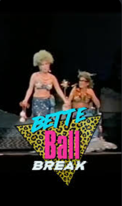 Two performers on a stage in swimsuits with a neon poster reading 'BETTE Ball BREAK' in bold colors.