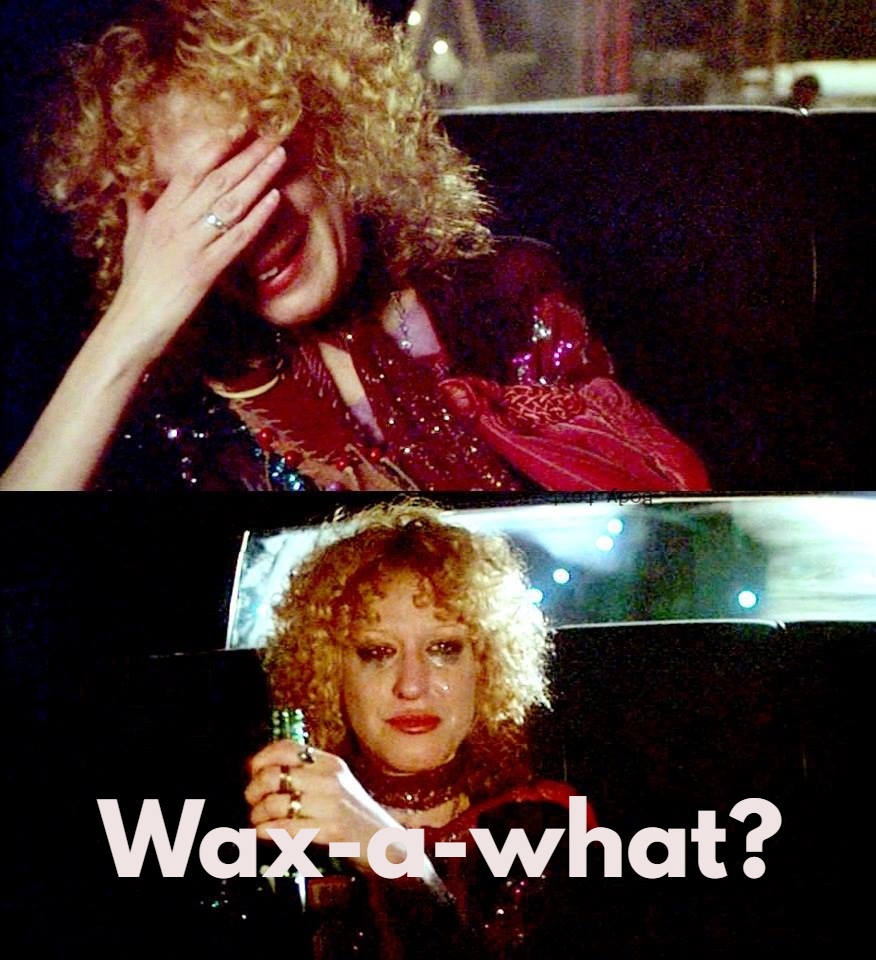 Two-panel meme: a curly-haired woman in a red scarf covers her face in the top panel, then looks surprised holding a bottle in the bottom panel with the caption ‘Wax-a-what?’
