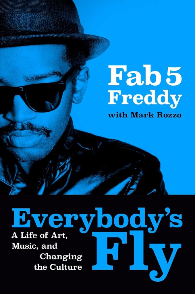 Blue-tinted book cover showing Fab 5 Freddy in sunglasses and a hat; bold title 'Everybody's Fly' with subtitle 'A Life of Art, Music, and Changing the Culture' on a black/blue background.
