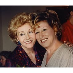 De8cb6ef47808e6ecef178388e6a7484 1 - bootleg betty Two women smiling for a photo together at a social event or party.