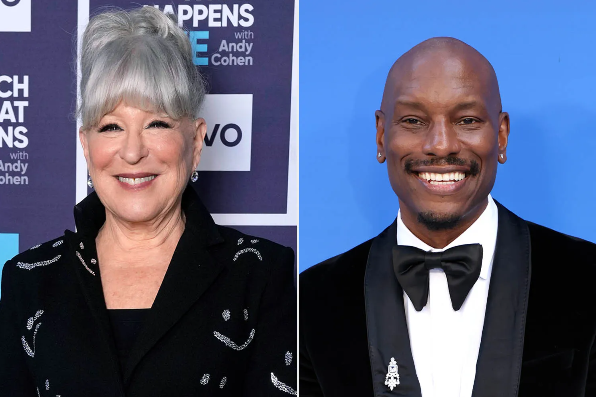Two well-dressed people posing at an event: a smiling woman with gray hair on the left and a smiling man in a black tuxedo on the right with a blue backdrop behind him.