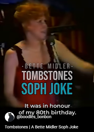 Stage performer on a dark set with on-screen text: 'BETTE MIDLER', 'TOMBSTONES', 'SOPH JOKE'; caption reads 'It was in honour of my 80th birthday'.