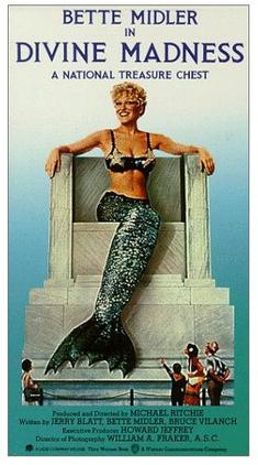 Poster for Divine Madness featuring Bette Midler in a mermaid outfit perched on a stone pedestal, with the film title at the top and a crowd scene at the bottom.