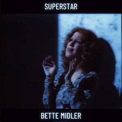 Still from Superstar (1973) showing Bette Midler in a blue dress, with 'SUPERSTAR' at top and 'BETTE MIDLER (1973)' at bottom.