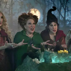 Three witches stand around a glowing cauldron in a moonlit forest, gesturing as they cast a spell.